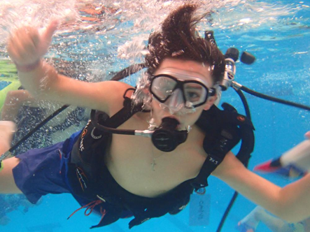 Kid snorkeling in ocean