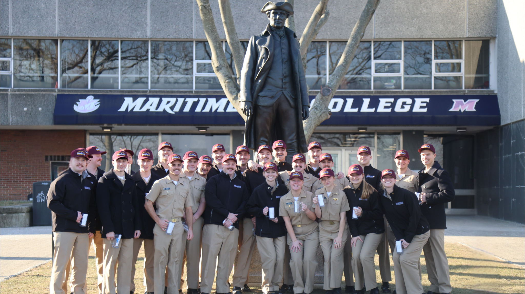 Licensed Cadets standing by the SNUG Harbor statue