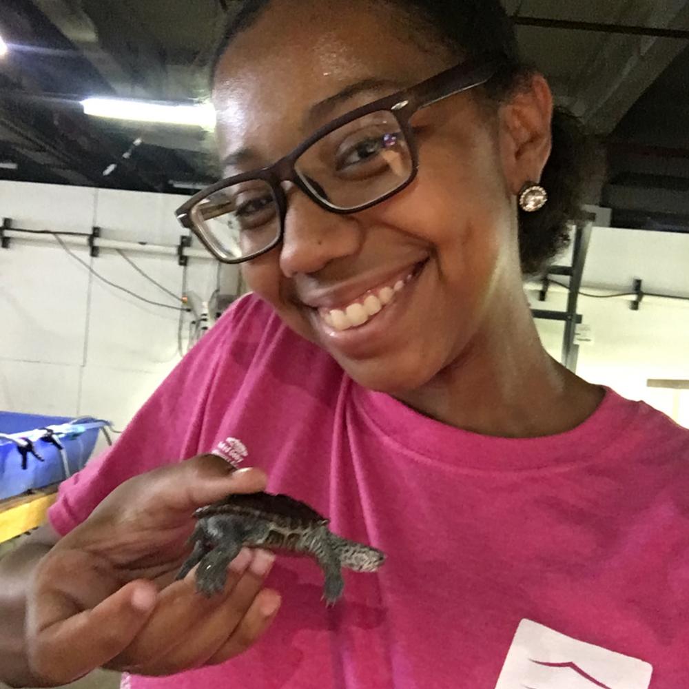 D'Leslie with a turtle