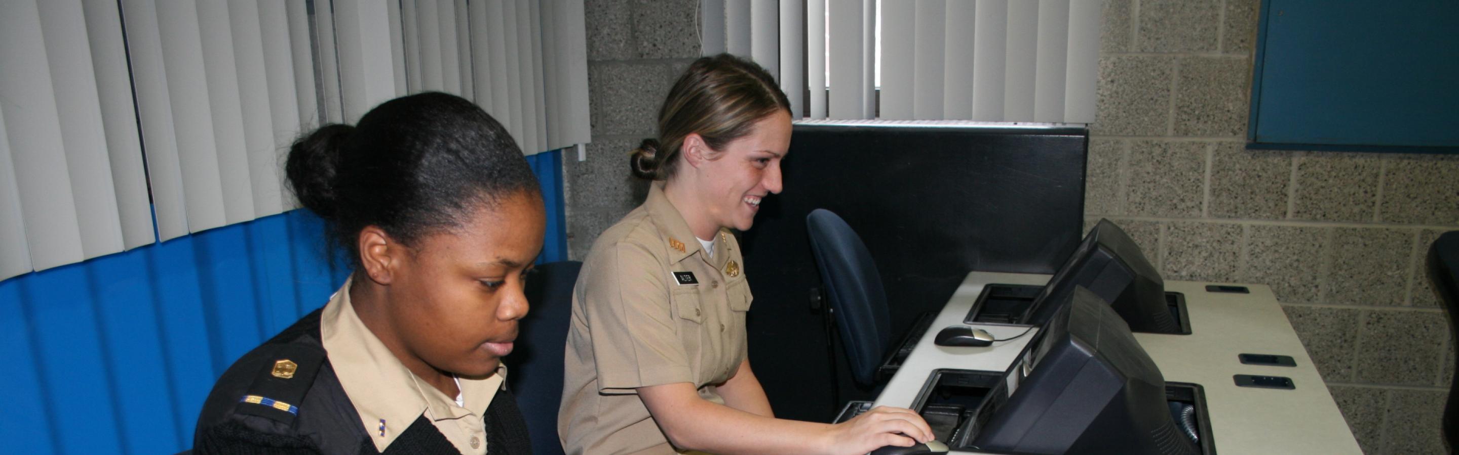Women sitting at a desk looking at their computers