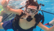 Kid snorkeling in ocean