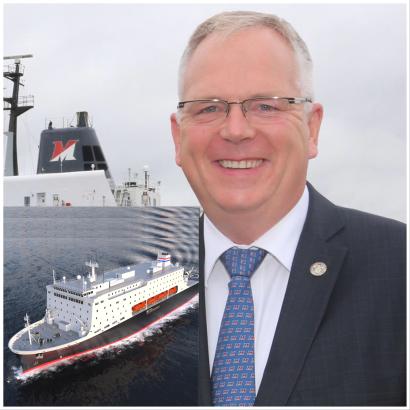 Rear Admiral Michael Alfultis with new training ship Rear Admiral Michael Alfultis with new training ship